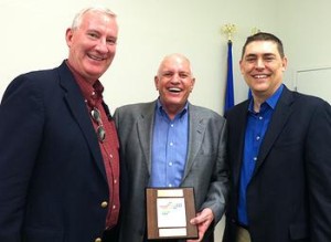 Warren Wimmer, John Monahan, and Terry Goddard II celebrate the Paul Starke Awards.